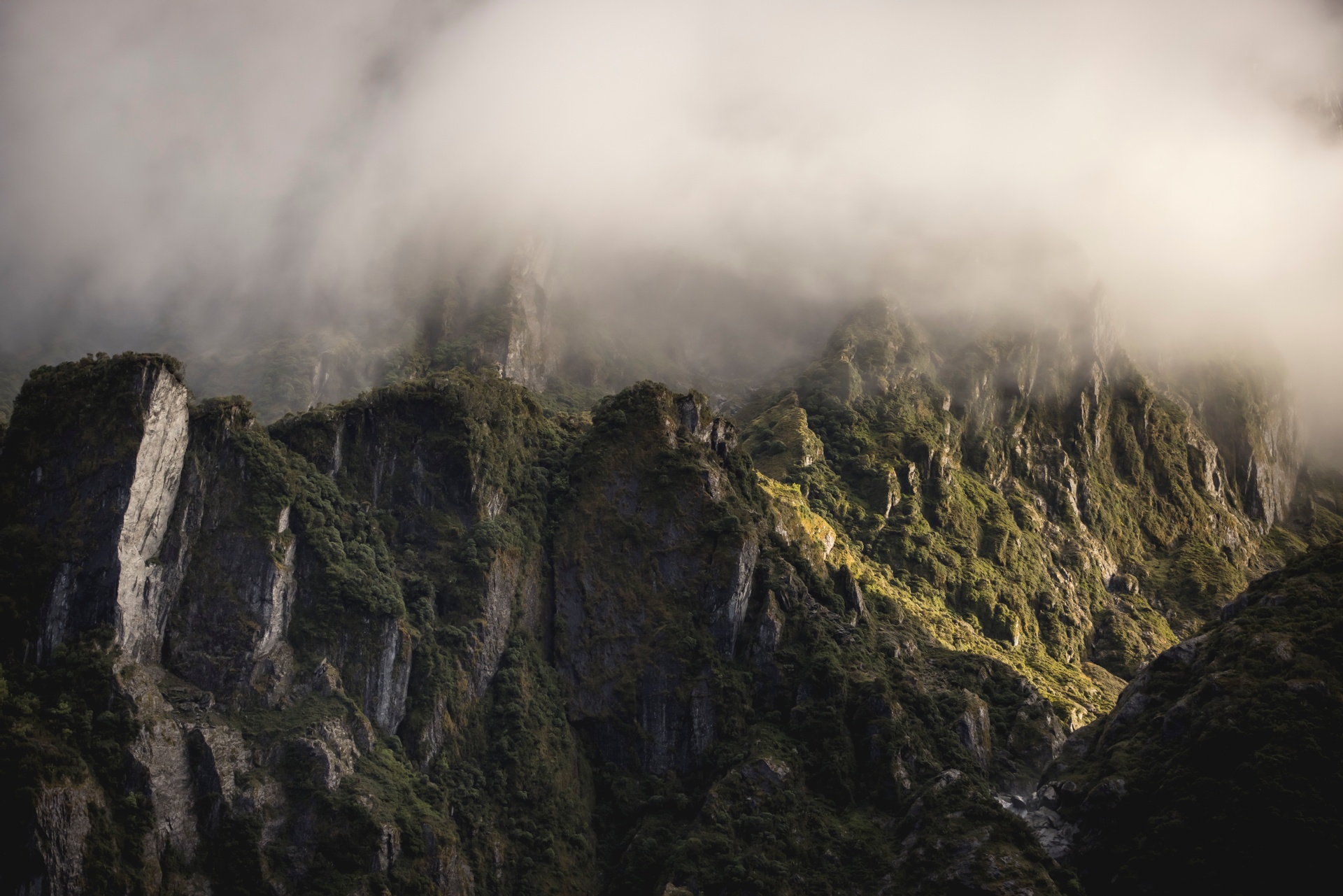 Rugged mountain range with clouds